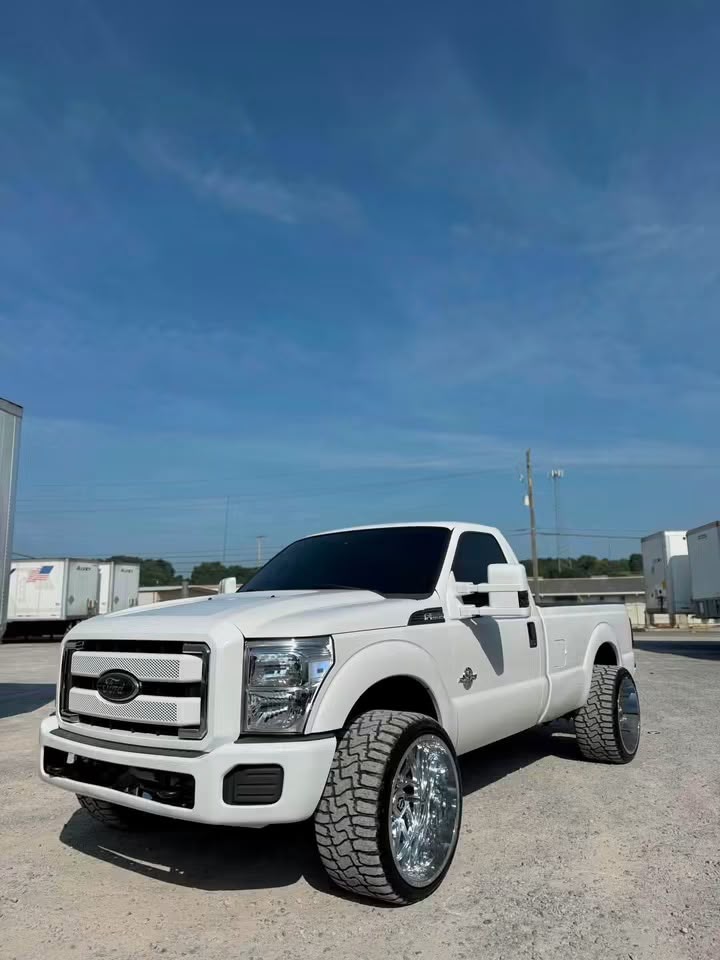 2013 Ford F-250 Super Duty white single cab front driver-side quarter view